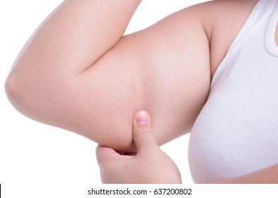 asian fat women has overweight. she used hands squeezing excess fat of the arms. isolated on white background. she wants lose weight. concept of surgery and subcutaneous fat breakdown.