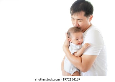 Asian Father Carry And Hug Adorable Baby Girl , Happy Family And Father Day Concept