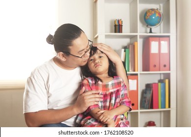 Asian Father Comforting Calming Her Sad And Crying Daughter, Single Dad And Baby Girl Together