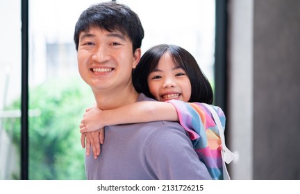 Asian Father And Daughter At Home