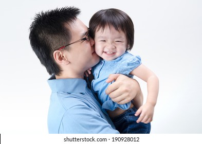 Asian Father And Daughter On Plain Background