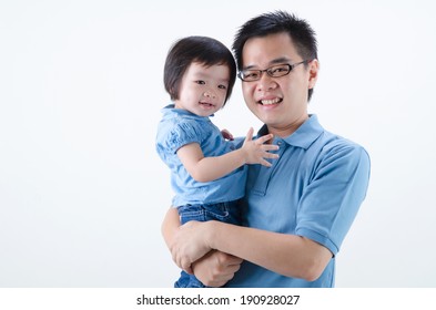 Asian Father And Daughter On Plain Background