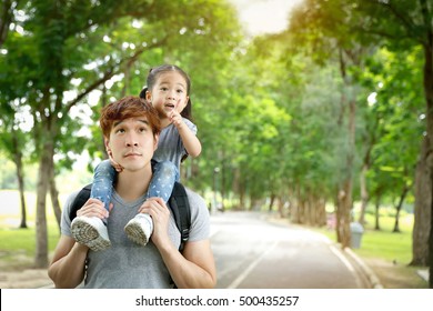 Asian Father And Daugther Have Fun In The Park, Father's Day Concept