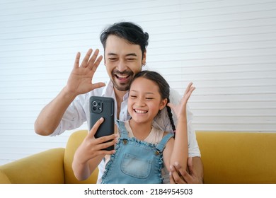 Asian Father Enjoy To Selfie With His Daughter.