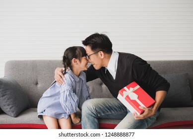 Asian Father Give Present For Daughter And Kiss. Concept Surprise Gift Box For Birthday.