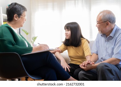 Asian Father, Grandfather And Mental Health Patient, Girl Child, Granddaughter Have Appointment Visit Doctor At Clinic, Consulting Psychiatrist, Treatment By Therapy. Health Care, Check Up Medical.