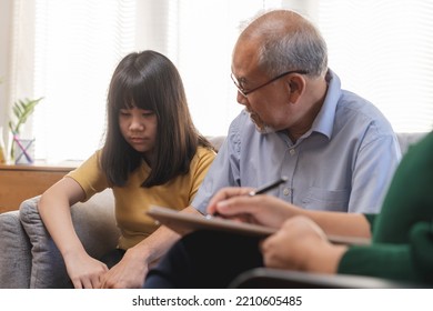 Asian Father, Grandfather And Mental Health Patient, Girl Child, Granddaughter Have Appointment Visit Doctor At Clinic, Consulting Psychiatrist, Treatment By Therapy. Health Care, Check Up Medical.