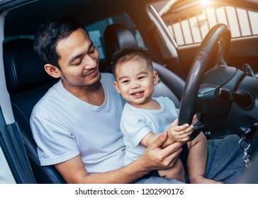 Asian Father And His Son Is Prepare To Driving Or Riding A Car For Travel On Sunday Or Holiday.