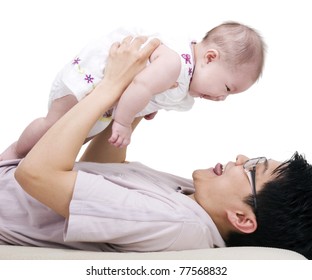 Asian Father Picking Up His 4 Months Old Daughter