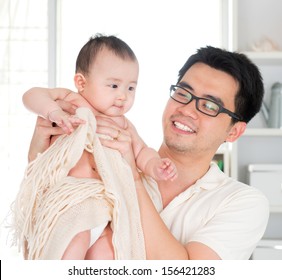 Asian Father And Six Months Old Baby Girl