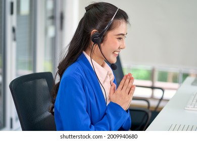 Asian Female Call Center Say Hi In Thai Style To Customer In Computer Screen For Body Language Concept