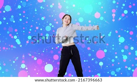Asian female dancer dancing on stage.