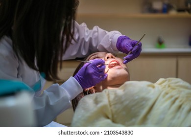 Asian Female Dentist Check Up Her Patient Teeth Healthy In Dental's Office. Dental Care, Medical Care, Lifestyle, Dental Clinic Or Dental Procedure Concepts