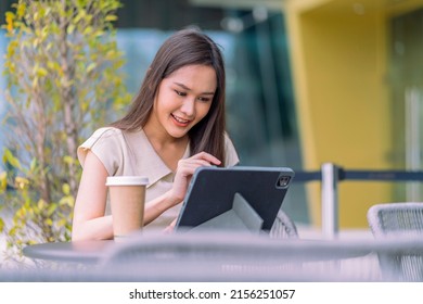 asian female digital nomad happiness freedom cheerful smiling working using tablet in garden outdoor,asia woman freelance relax leisure working anywhere work and travel iwith garden bokeh background - Powered by Shutterstock