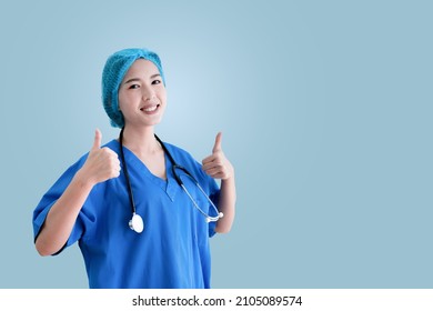 Asian Female Doctor In Blue Surgical Gown, Isolated Background