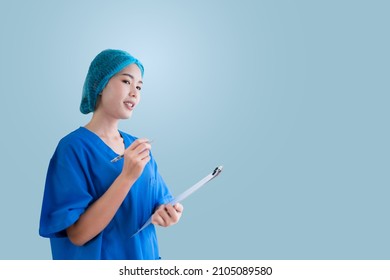 Asian Female Doctor In Blue Surgical Gown, Isolated Background