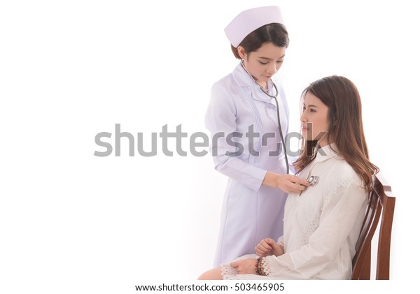 Asian Female Doctor Checking Patient Heartbeat Stock Photo Edit Now