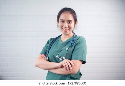 Asian Female Doctor Healthcare Worker Confident Strong Happy Smiling Cheerful, Medical Surgeon Nurse Professional Specialist Expert Wearing Uniform Stethoscope Standing White Isolated Background