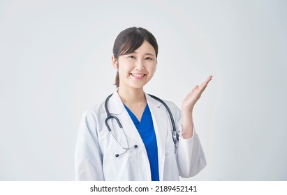 Asian Female Doctor Pointing Side White Stock Photo 2189452141 ...