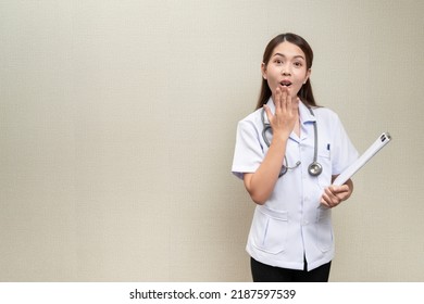Asian Female Doctor Wearing White Short Sleeve Medical Uniform Hung Heart Rate Monitor Around His Neck Stood With His Hand Over His Mouth Showing Shocked Expression With Confidence Isolated Background