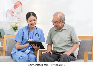 Asian female doctor who works in office and consults to patient explains health care symptoms and help elderly man, give medicines. Writing down diagnosed and symptoms, elderly care, health care - Powered by Shutterstock