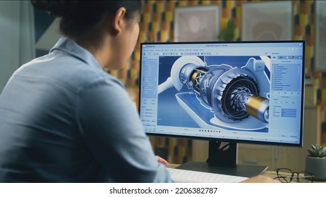 Asian Female Engineer Drawing Wind Turbine 3D Spare Part In Professional 3D Modeling Program On Pc While Working On Project At Home Office