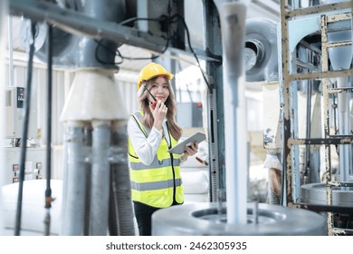 Asian female engineers in their daily tasks within factories and industrial settings, providing seamless access to information, design software, and collaborative platforms. - Powered by Shutterstock