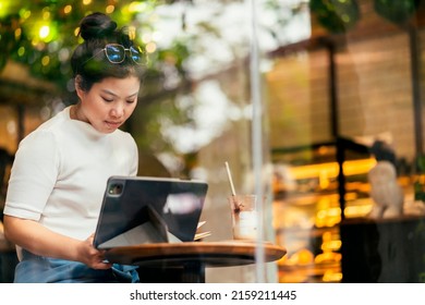 Asian Female Freelance Digital Nomad Career Happiness Workation Cheerful Smiling Working Online With Smart Device Tablet Smartphone Abroad Occupation Project Work Anywhere New Frameless Lifestyle Cafe