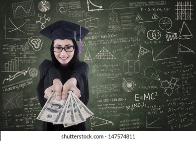 Asian Female Graduate Giving Money In Classroom - Education Cost Concept