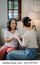 Asian Female Hands Touching Old Female Hand Helping Hands Take Care Of The Elderly Concept
