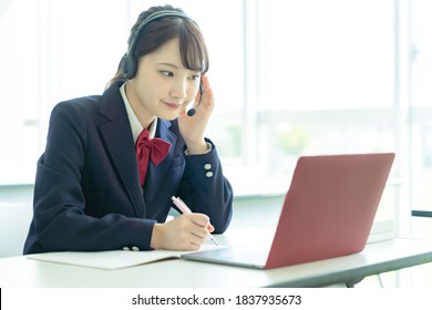 Asian Female High School Student Taking Online Class.