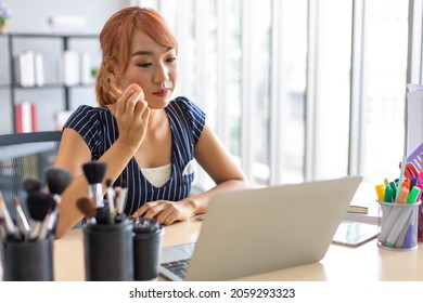 Asian Female Influencer Makeup Artist Talking About Makeup On Laptop Computer At Home.