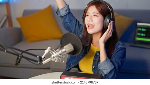 Asian Female Internet Celebrity Raising Her Arm Have Live Stream And Singing With On Air Light Sign At Home