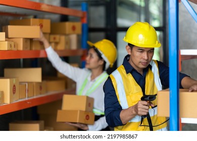 Asian Female And Male Warehouse Worker Working At The Storehouse. Logistics , Supply Chain And Warehouse Business Concept.