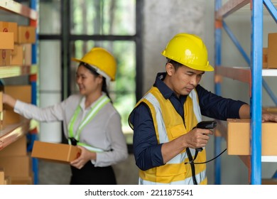 Asian Female And Male Warehouse Worker Working At The Storehouse. Logistics , Supply Chain And Warehouse Business Concept.