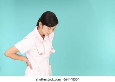 Asian Female Nurse Has A Back Pain