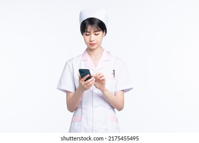 Asian Female Nurse On White Background