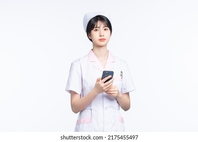 Asian Female Nurse On White Background