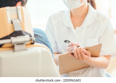 Asian Female Nurse And Patient (dentist)