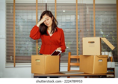 Asian Female Office Worker Working In A Financial Firm In Economic Hardship And Epidemic Packing Room Utensils In Boxes Crying In Sorrow Preparing To Switch To A New Job Depressed Woman At Workstation