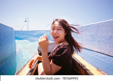 Asian Female On Log Flume Ride 