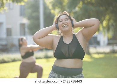 Asian female overweight in sportswear and headphone aerobic exercise physical activity. women plus size aerobic dance fitness lifestyle. concept of healthy. - Powered by Shutterstock