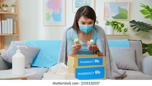 Asian Female Patient Wear Mask Covering Blanket Unpacked Medicine From Pharmacy Medication Package Box Delivery Service At Home