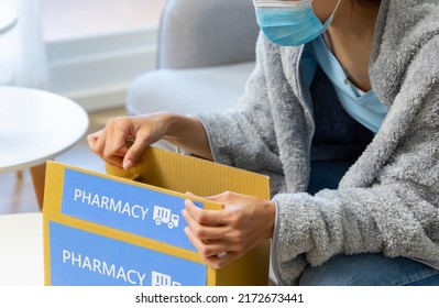 Asian Female Patient Wear Mask Covering Blanket Unpacked Medicine From Pharmacy Medication Package Box Delivery Service At Home