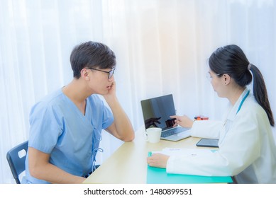 Asian female pats are describing the results of recommendations for health care methods to prevent diseases for male patients in hospitals through medical concepts. - Shutterstock ID 1480899551