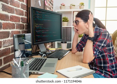 asian female programmer feeling crazy and overwhelmed about working in the office. - Shutterstock ID 1171194046