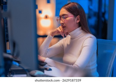 asian female programmer sits a dark tech workspace at night, fully focused on developing an online project. She writes HTML scripts and code for a modern website while contributing to automation work