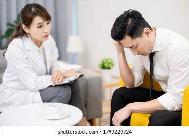 Asian Female Psychologist Has Consultation With Male Patient