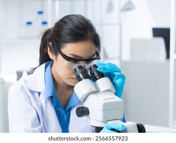 Asian female scientist uses a microscope in laboratory, analyzing chemical samples for medical research and vaccine development. female scientist analyzing data for vaccine research and development. - Powered by Shutterstock - Get 15% off with code: PIKWIZARD15