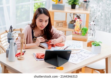 Asian Female Spend Weekend Day For Her Hobby Clay Scuplture Online Course At Home, Young Adult Making Study From Tablet Streaming Course Online In Apron Costume,asian Casual Lifestyle At Home